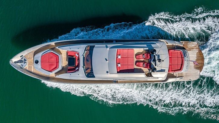 An aerial view of a yacht floating on top of a body of water.
