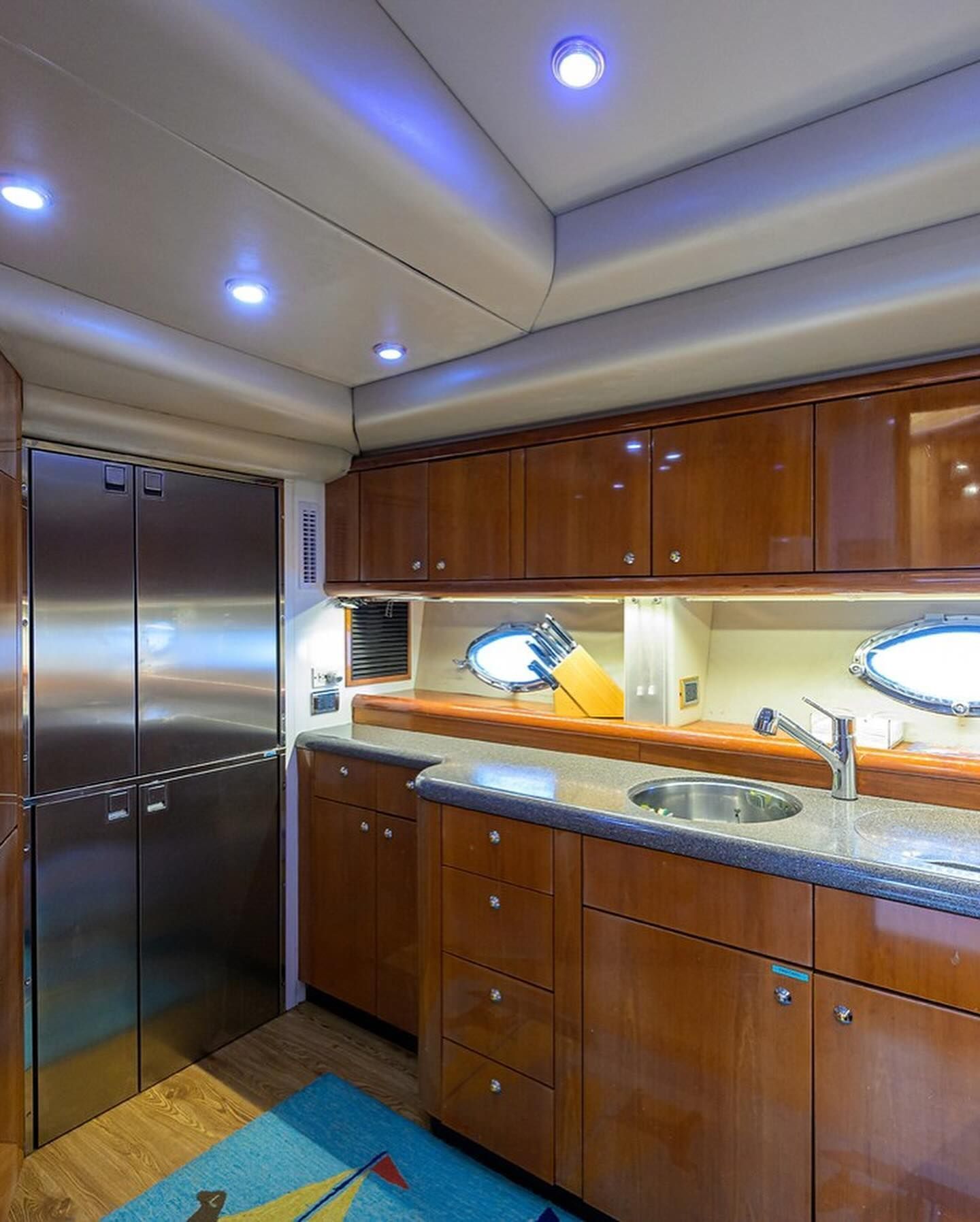 A kitchen with wooden cabinets and stainless steel appliances