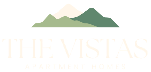 Logo of "The Vistas Apartment Homes" with mountain graphic in green and beige.