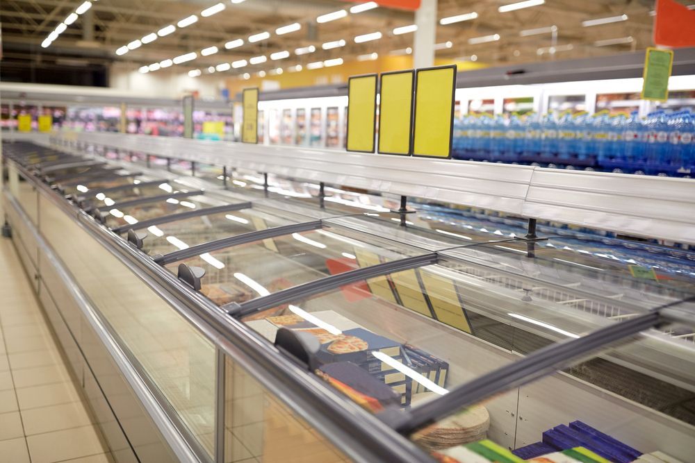 A Refrigerator In A Supermarket With A Glass Door Open — NQ Fridge & Freezer Seals In Manoora, QLD