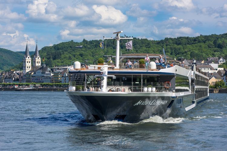Scenic view of a luxurious river cruise boat sailing along the Rhine River 