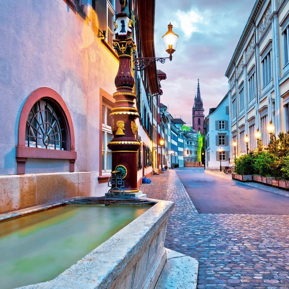 Streets in Basel at Sunset with church tower in the background