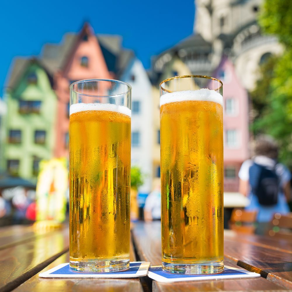 Cologne's Kölsch, a light and crisp beer served in Stangen with a background of Cologne or Köln