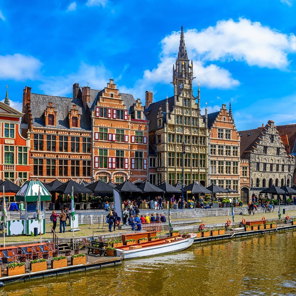 Ghent and canals with boats and restaurants 