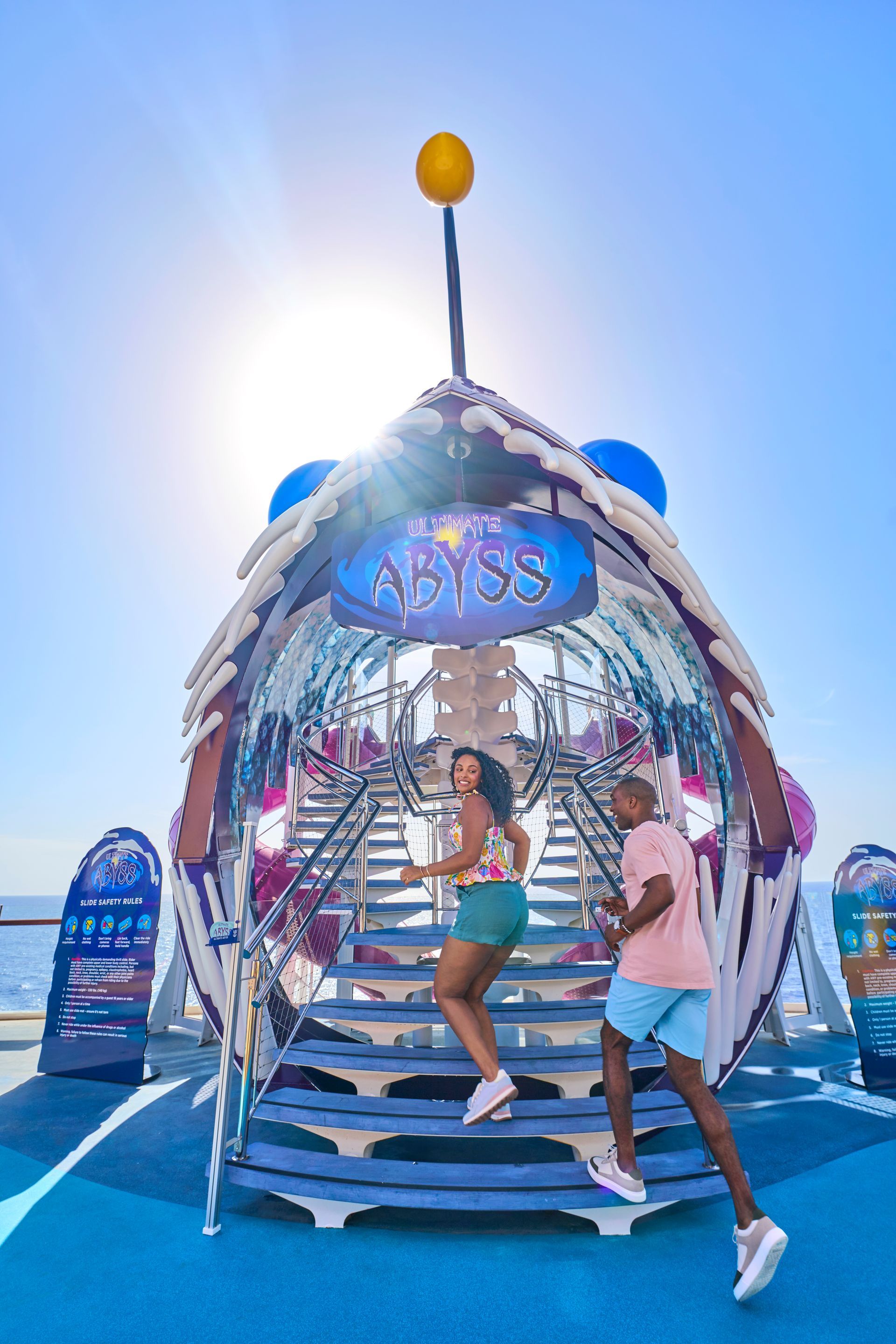 Utopia of the Seas with Children paying on the colorful deck getting ready for slides