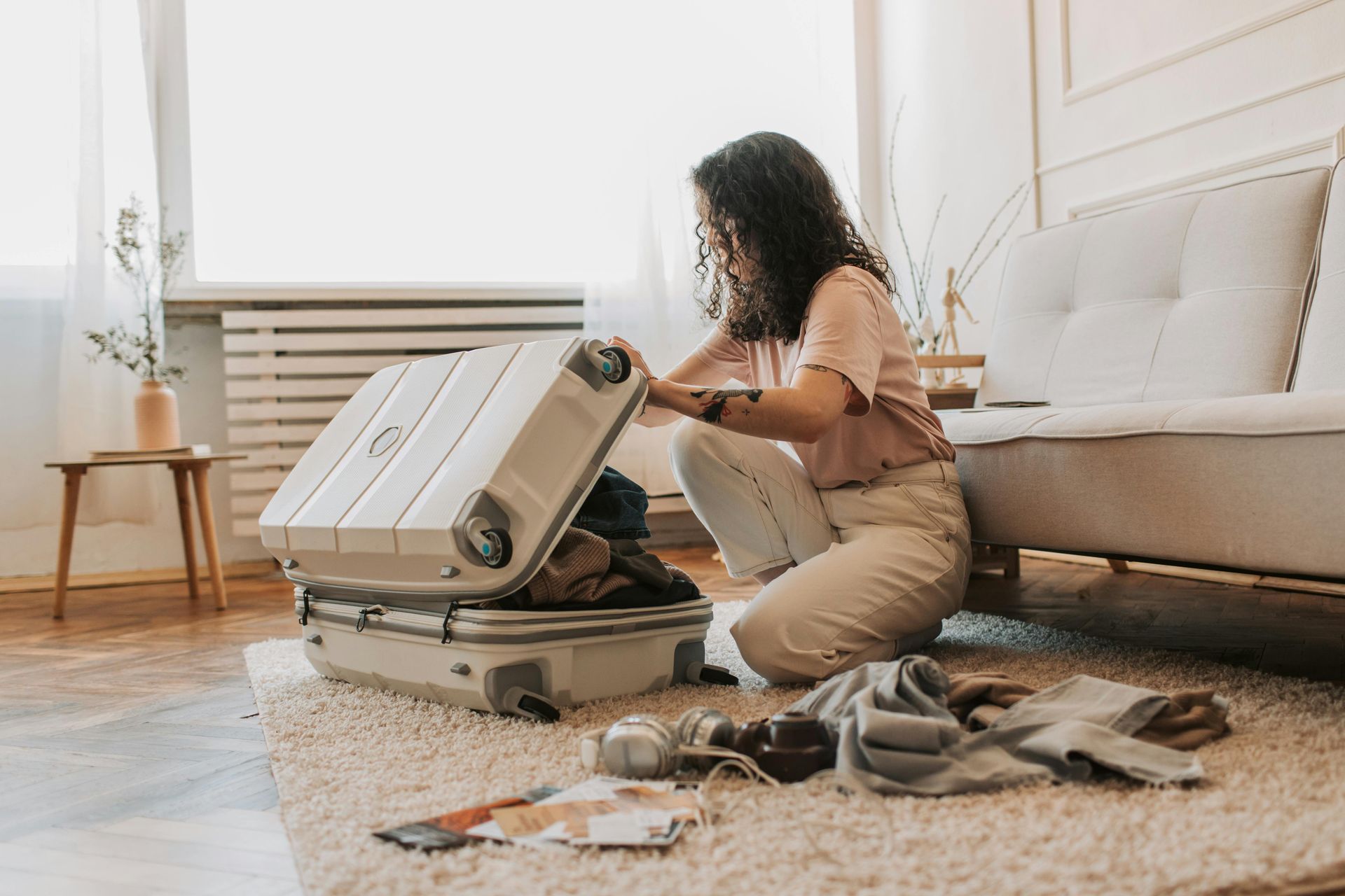 Woman packing suit case 