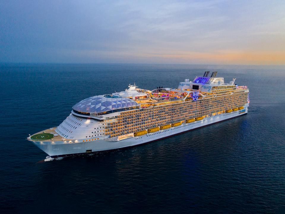 Utopia of the Seas in the Caribbean Ocean at sunset
