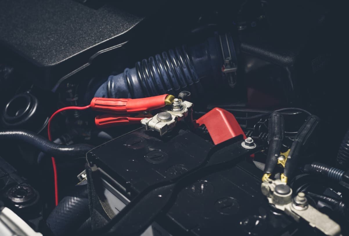 A Close Up Of A Car Battery In The Engine Compartment — Brad's Auto Electrical in Mareeba, QLD
