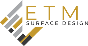 A logo for a company called etm surface design