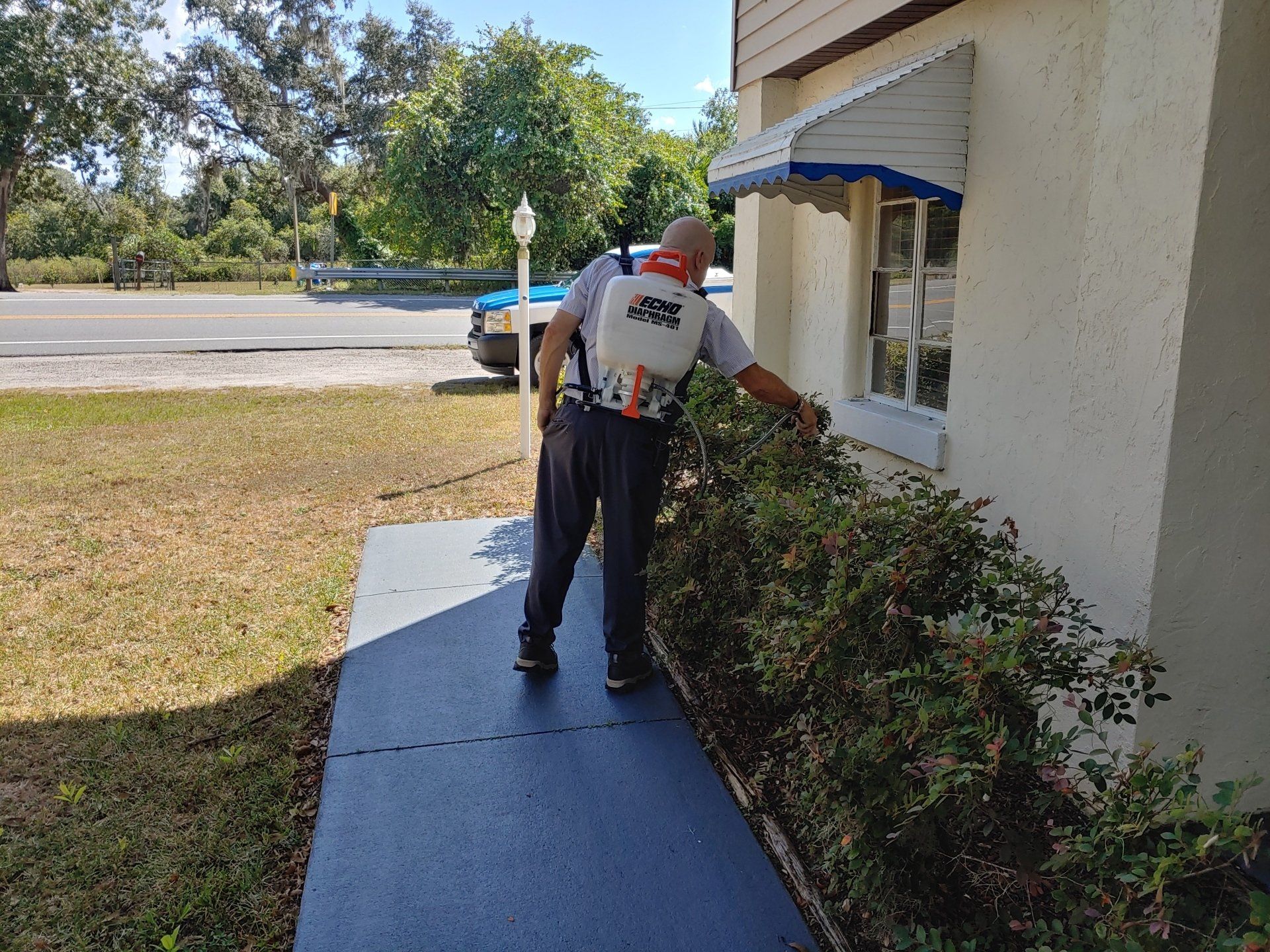 Ants — Woman Showing Exterminator where to Spray Pesticide in Tavares, FL