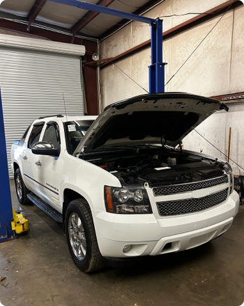 A white car at our repair shop | Profix Automotive LLC