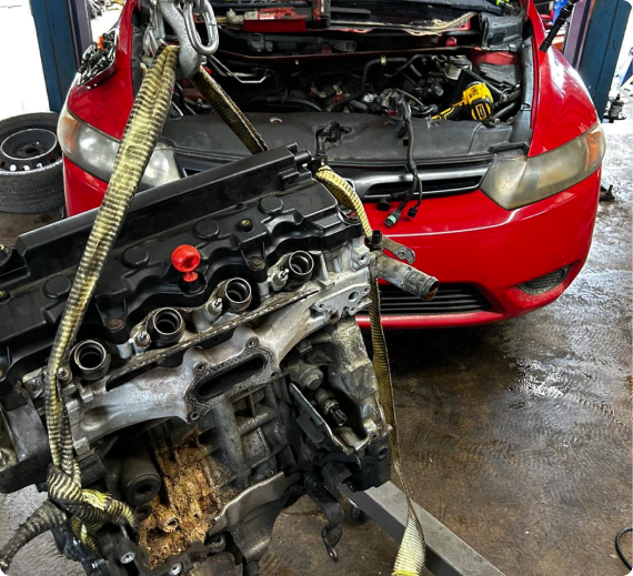 A red vehicle at our auto repair shop | Profix Automotive LLC