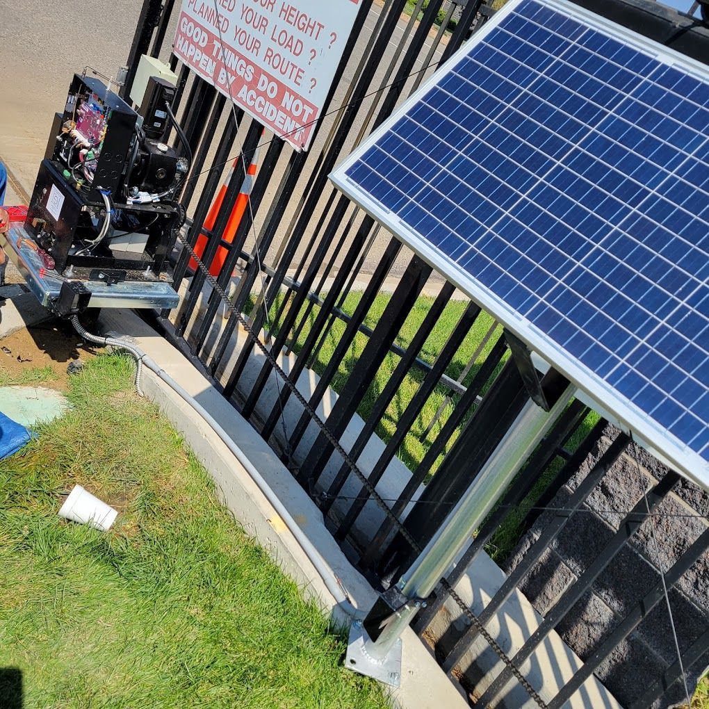 A solar panel is attached to a metal fence