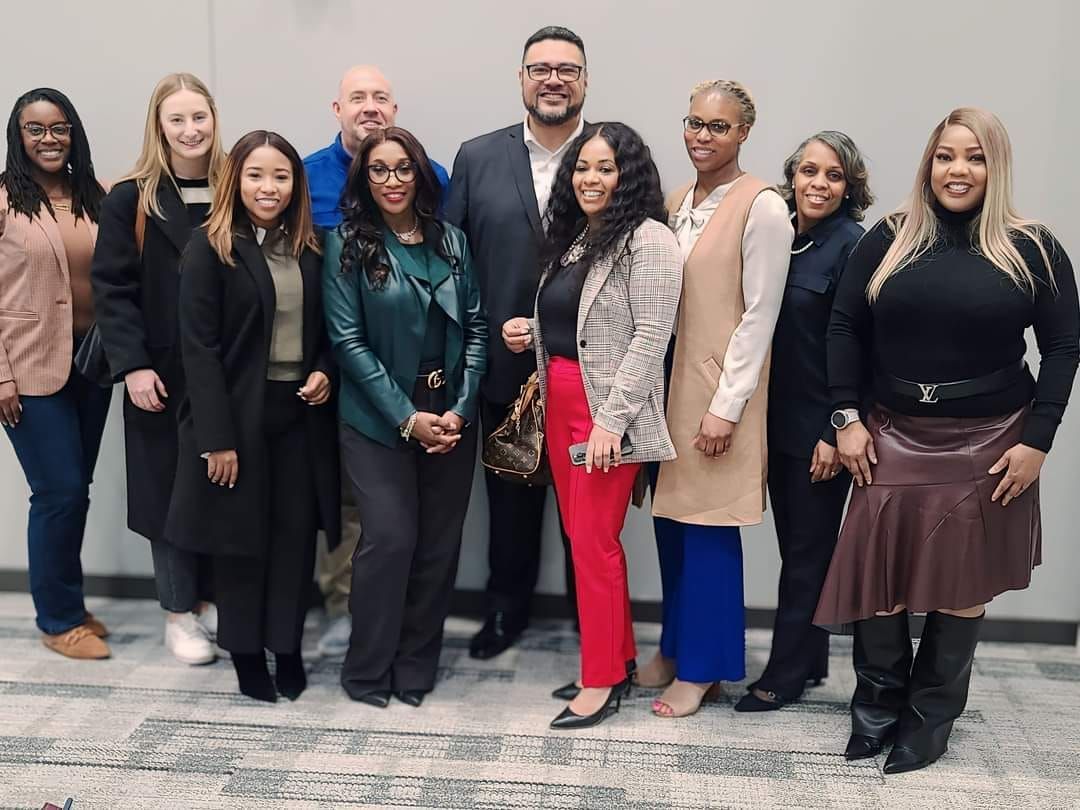 A group of people are posing for a picture together.