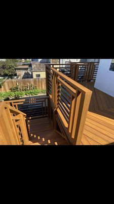 A wooden deck with stairs leading up to it.