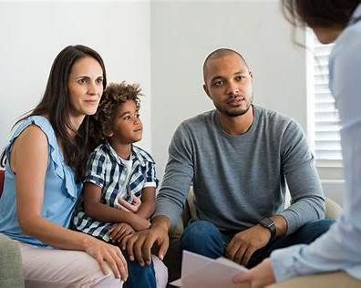 A person is handing a car key to another person.