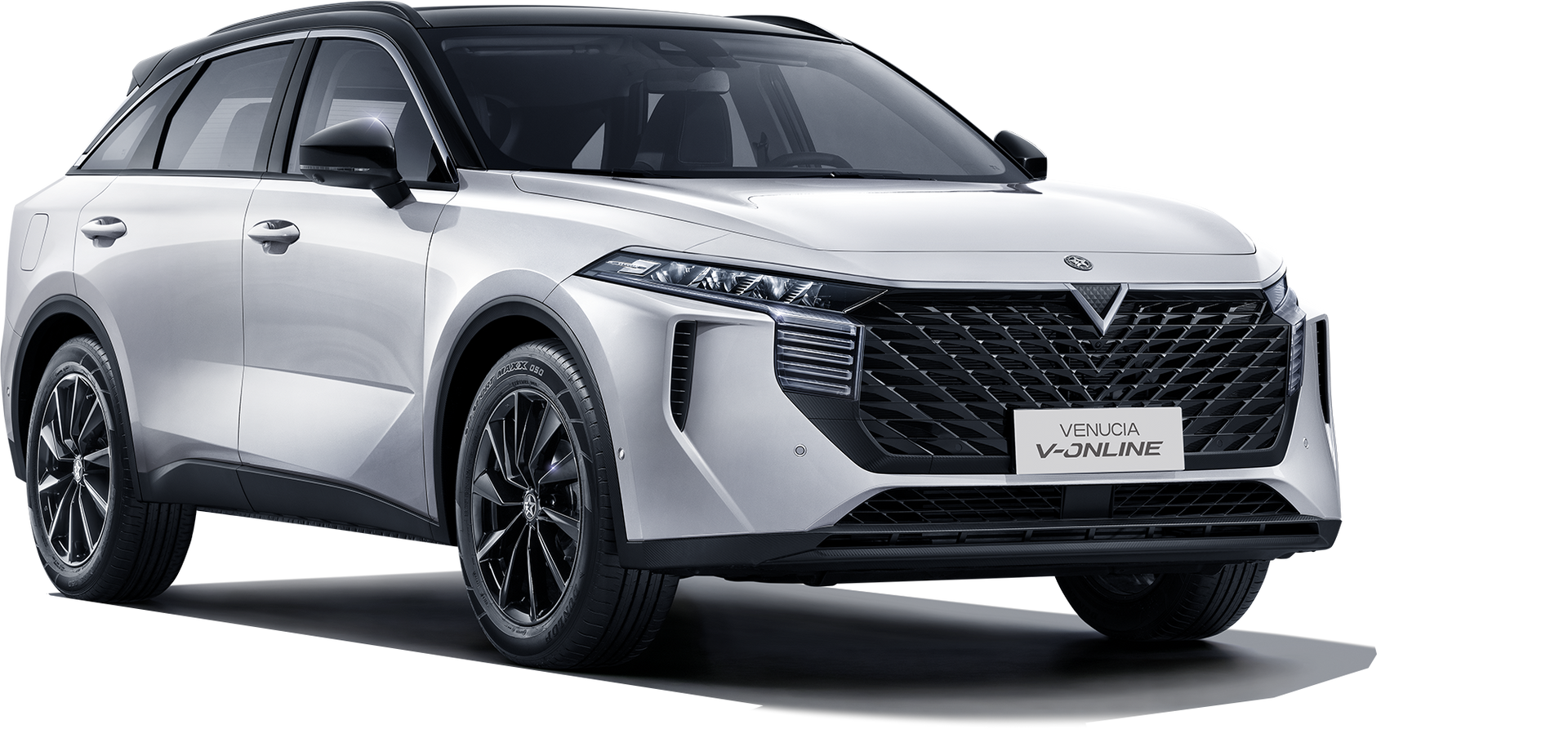 White VinFast VF 7 electric SUV. Front, slightly angled view. Black roof and wheels.