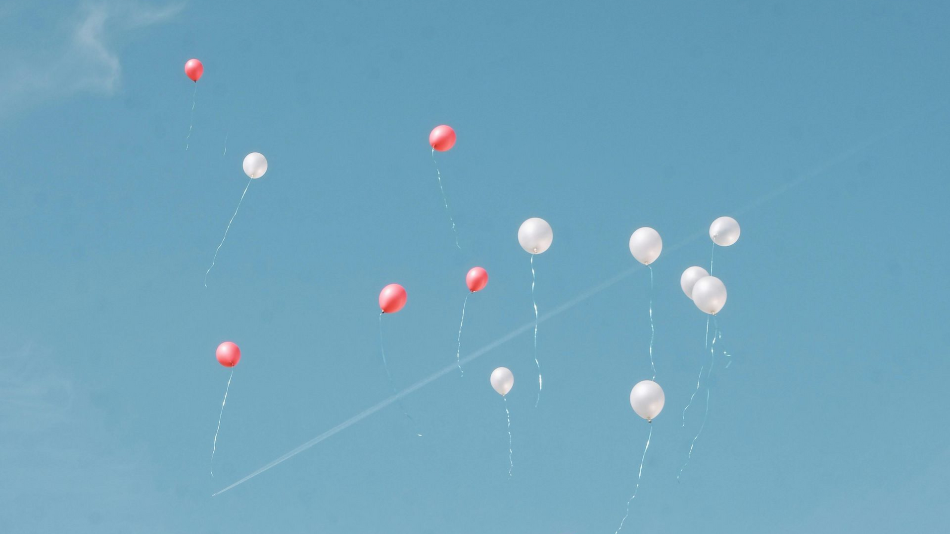 Letting go of balloons in the sky