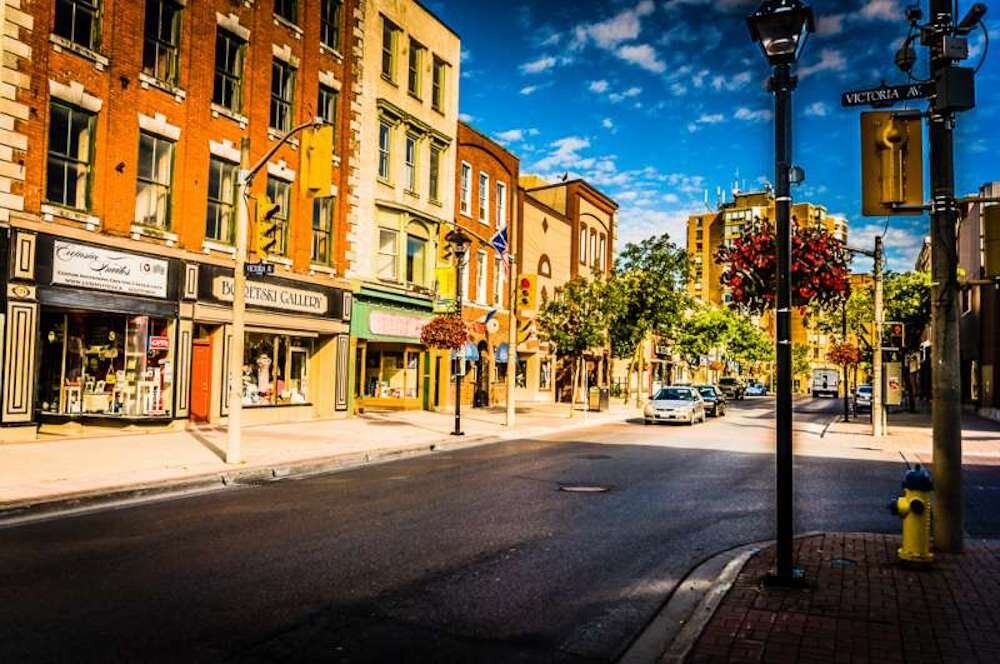 A city street with a fire hydrant in the middle of it