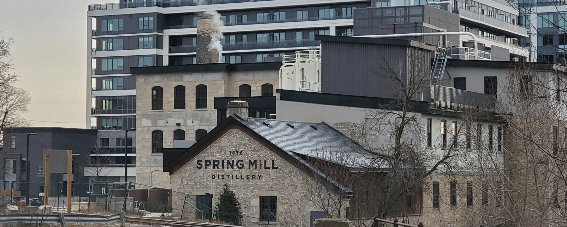 A large building with the word spring mill on it