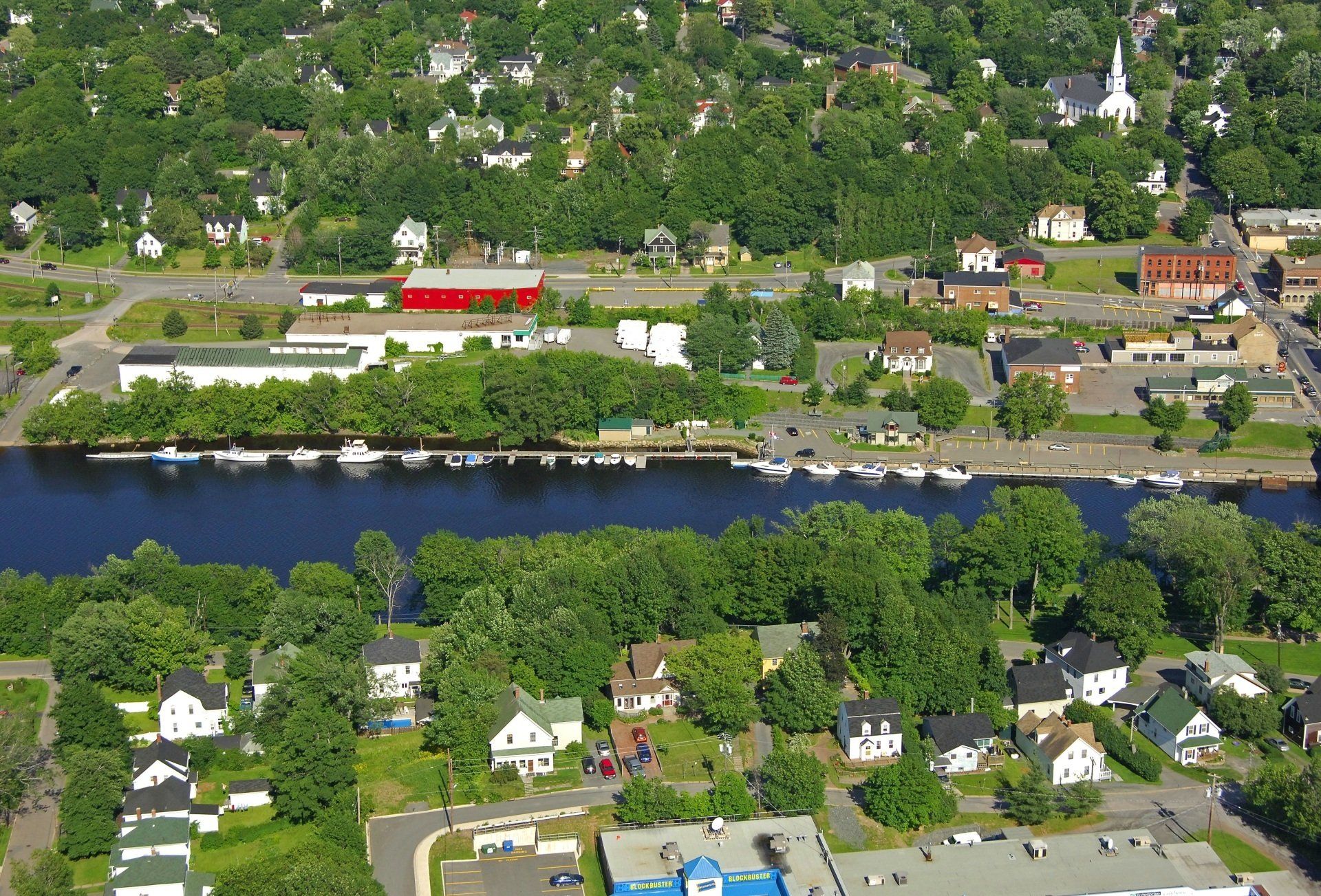 An aerial view of a small town with a river running through it