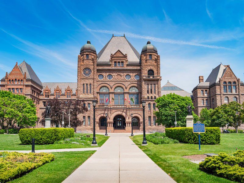 A large brick building with a walkway leading to it