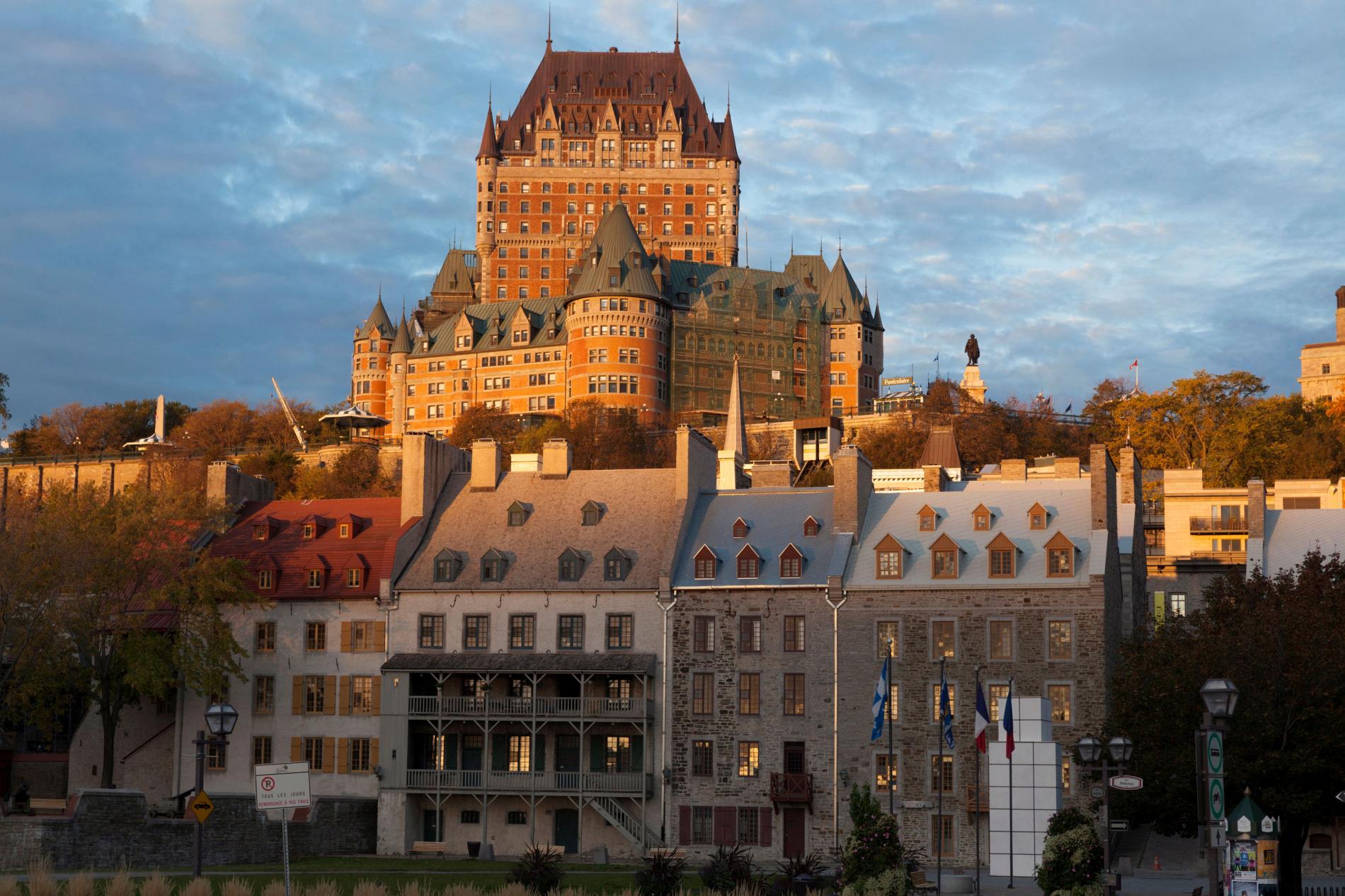 A large building with a castle in the background