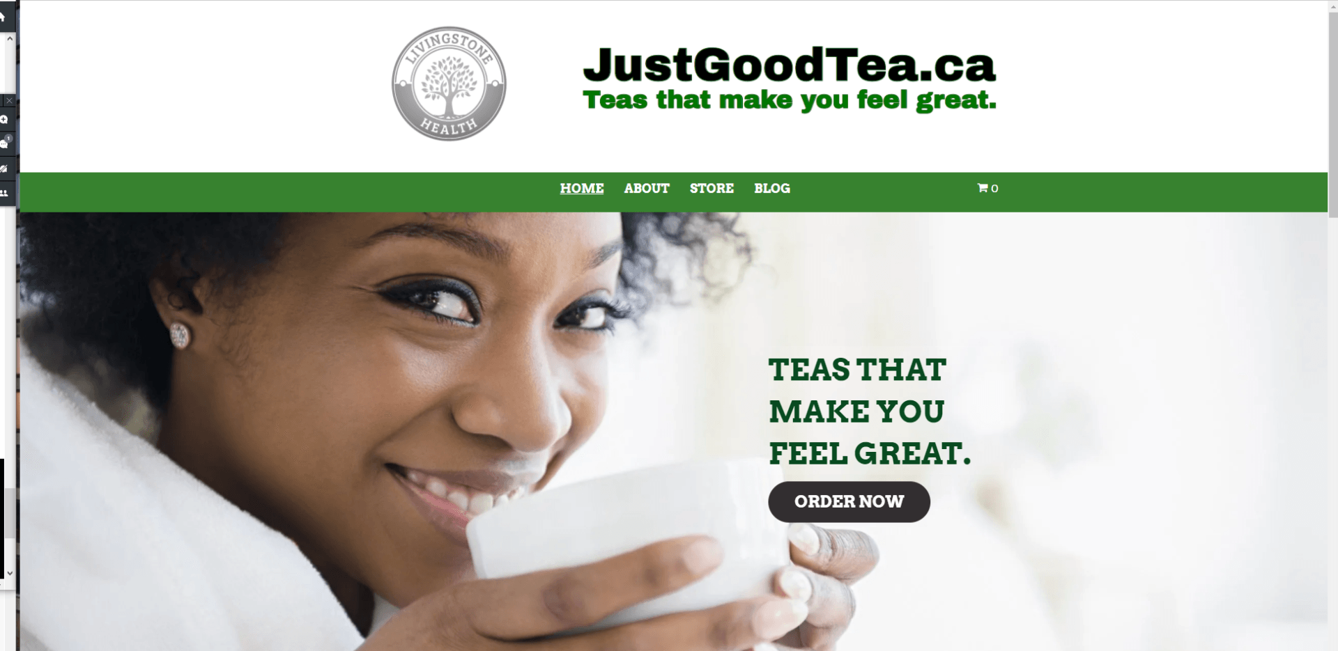 A woman is smiling while holding a cup of tea.