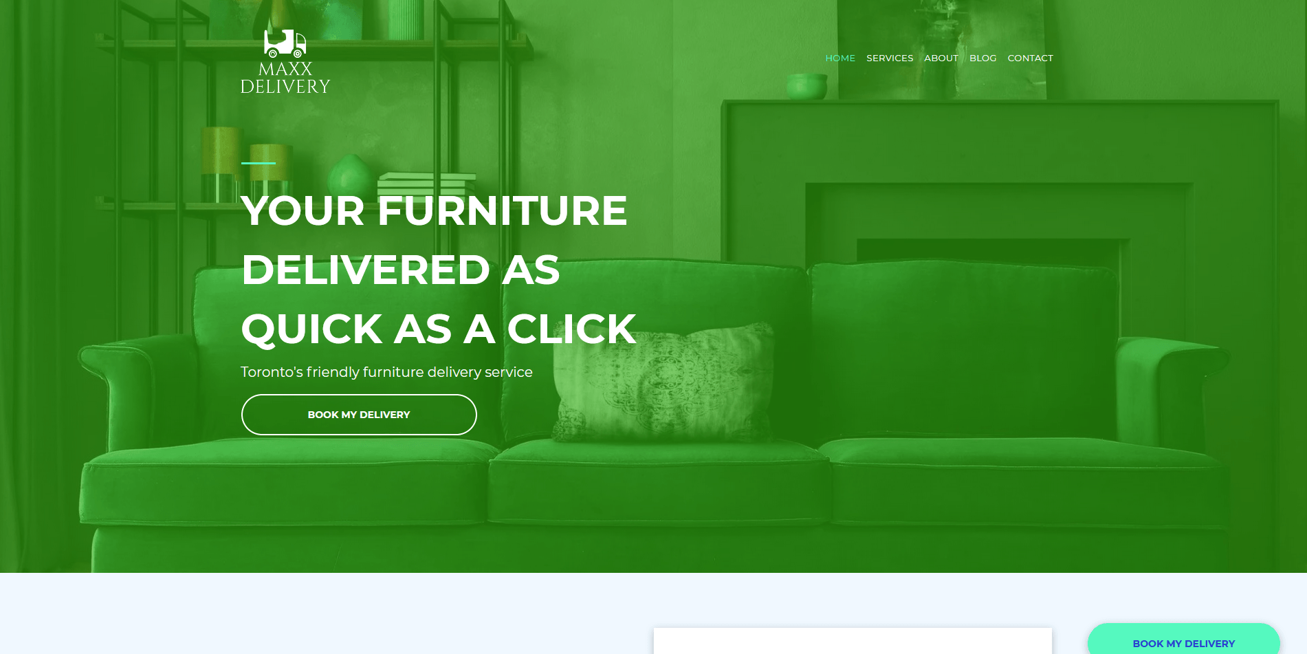 A green couch is sitting in a living room next to a fireplace.