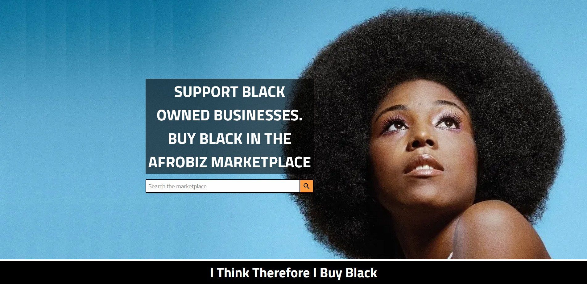 A woman with an afro looks up at the sky