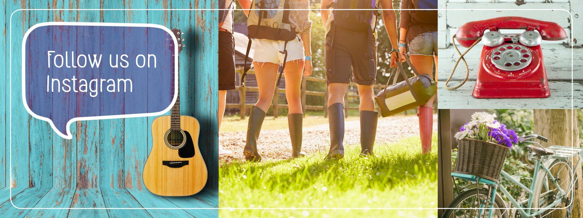 A group of people are standing in the grass with a guitar and a red telephone.