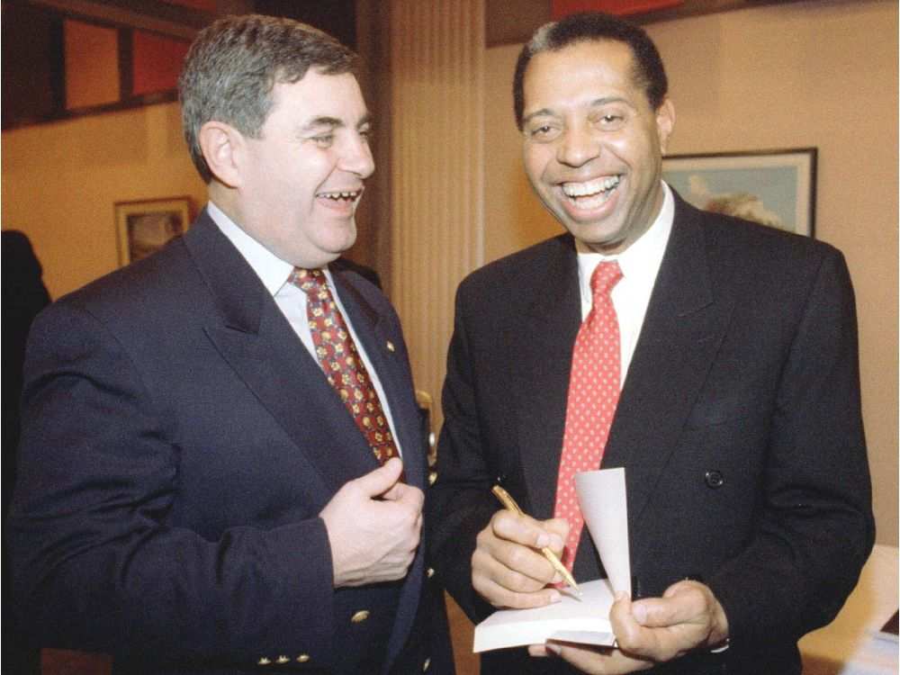 ”I can remember answering calls with a junior partner and when we got to the place, the people would just talk to the white officer,” said Edouard Anglade in 1996, recalling those early years on the Montreal police force. Beside him, Jacques Duchesneau, Montreal police chief at the time.