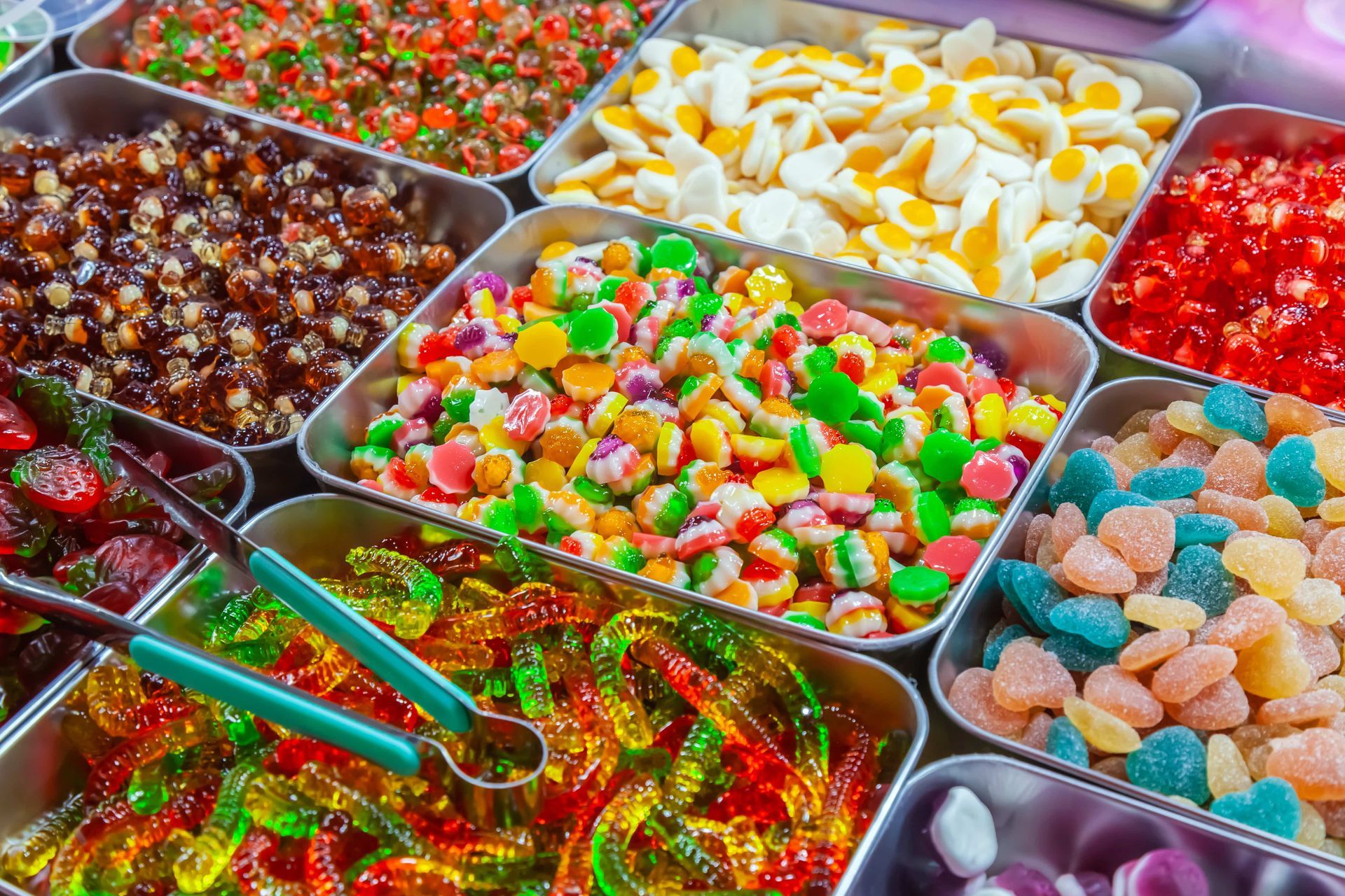 There are many different types of candy in the trays.