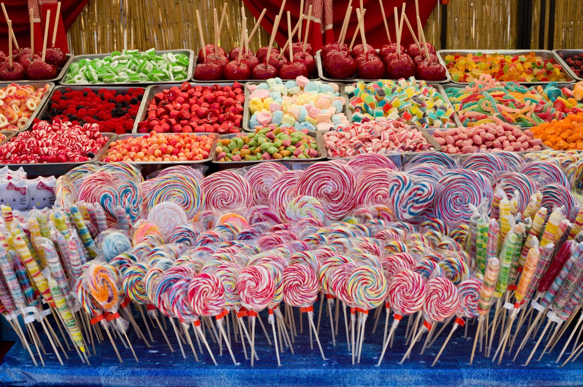 A table filled with lots of colorful lollipops and other candy.