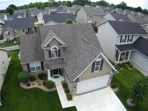 An aerial view of a house with the letter h on the roof