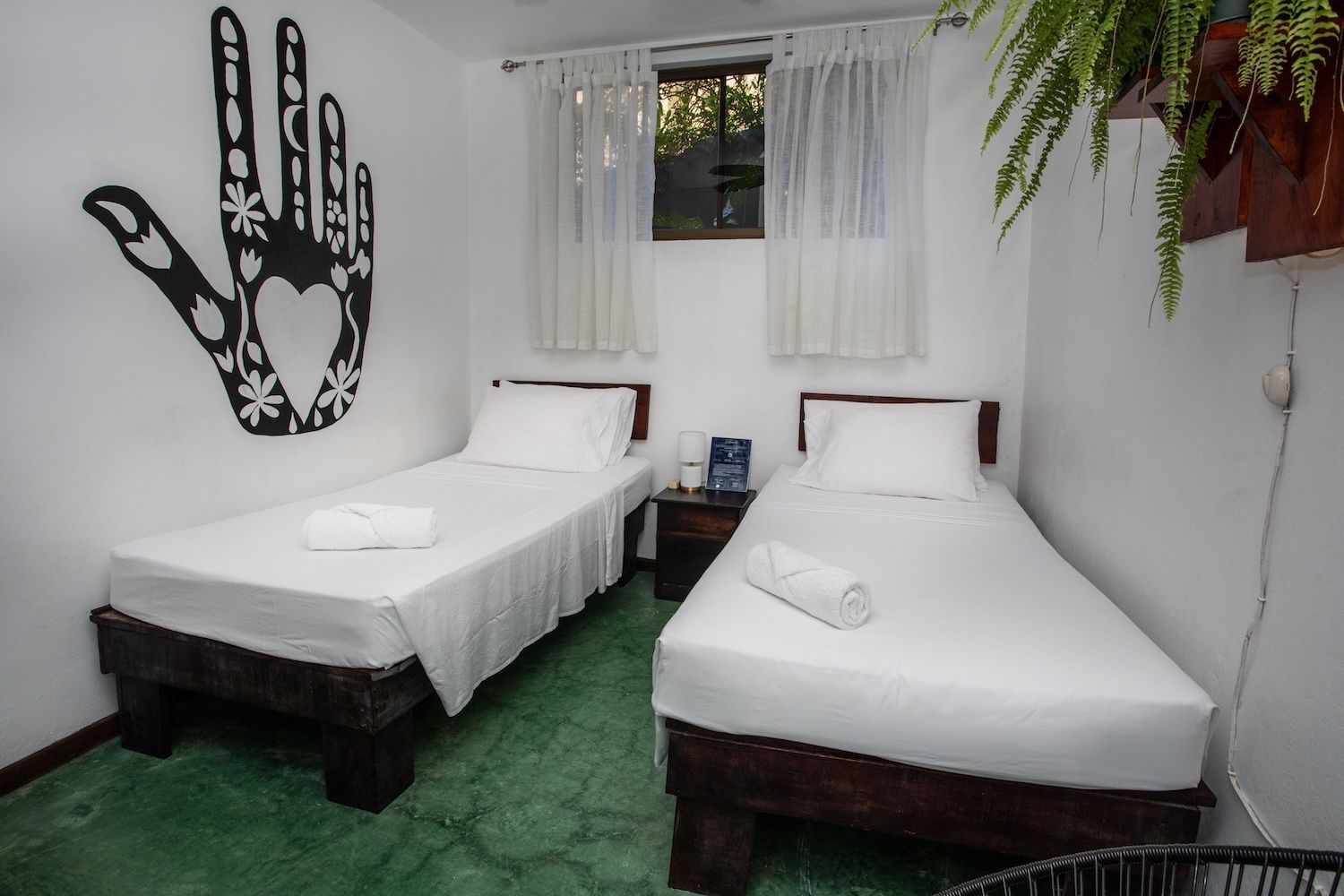 private room with two twin beds and a shared bathroom