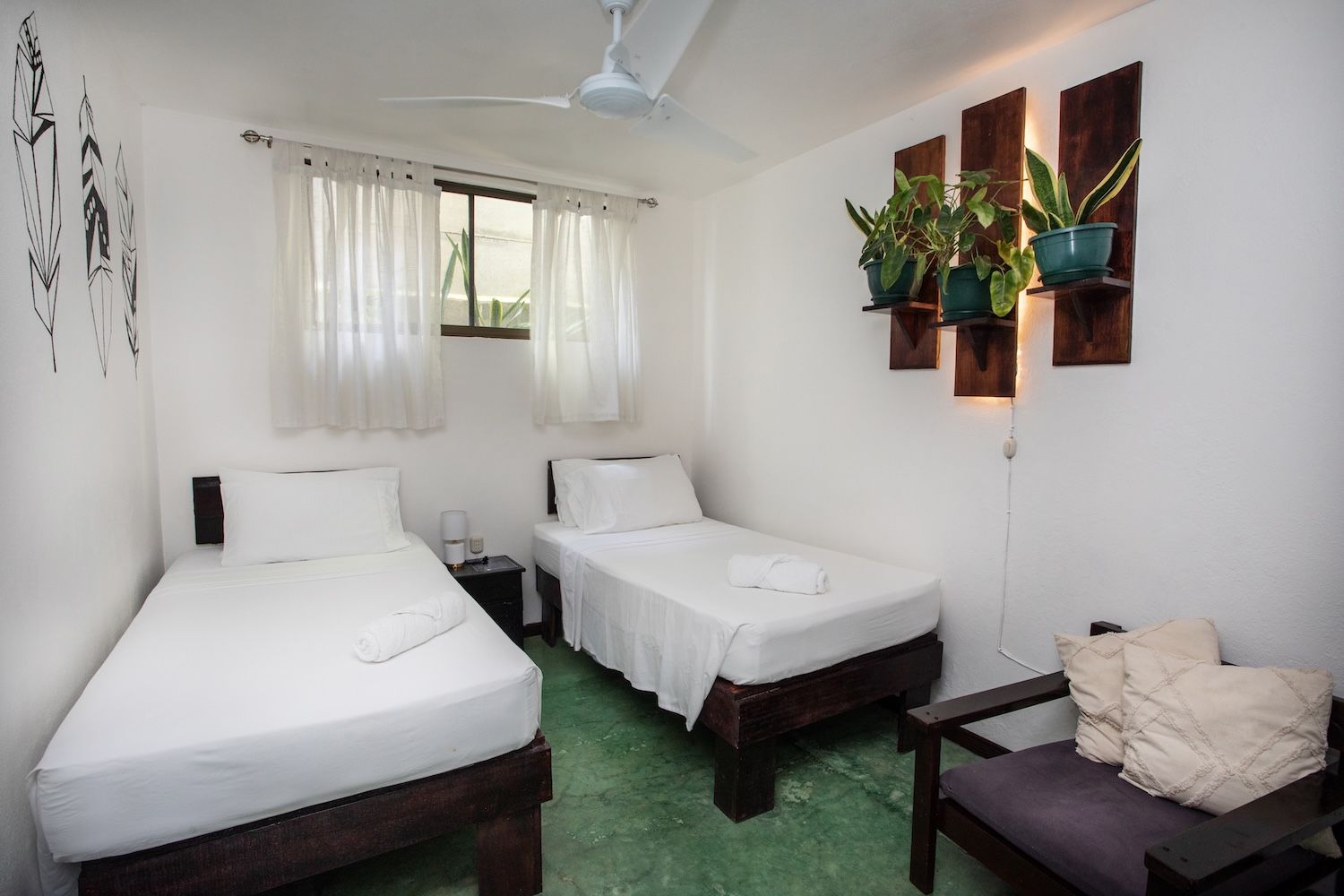 private room with two twin beds and a shared bathroom