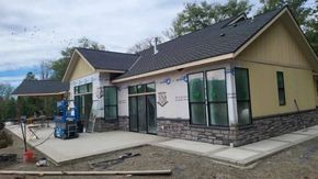 New home under construction with exterior painting in progress