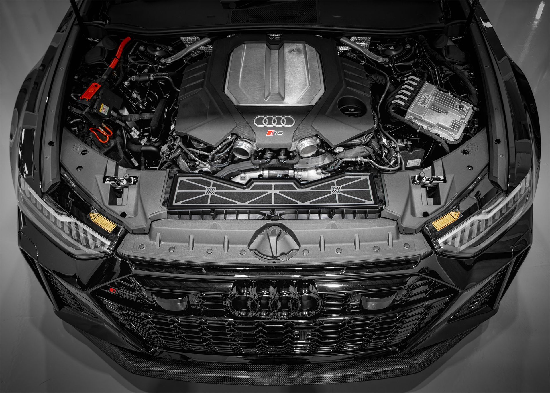 Engine Bay of an Audi RS vehicle featuring a powerful engine and organised components.