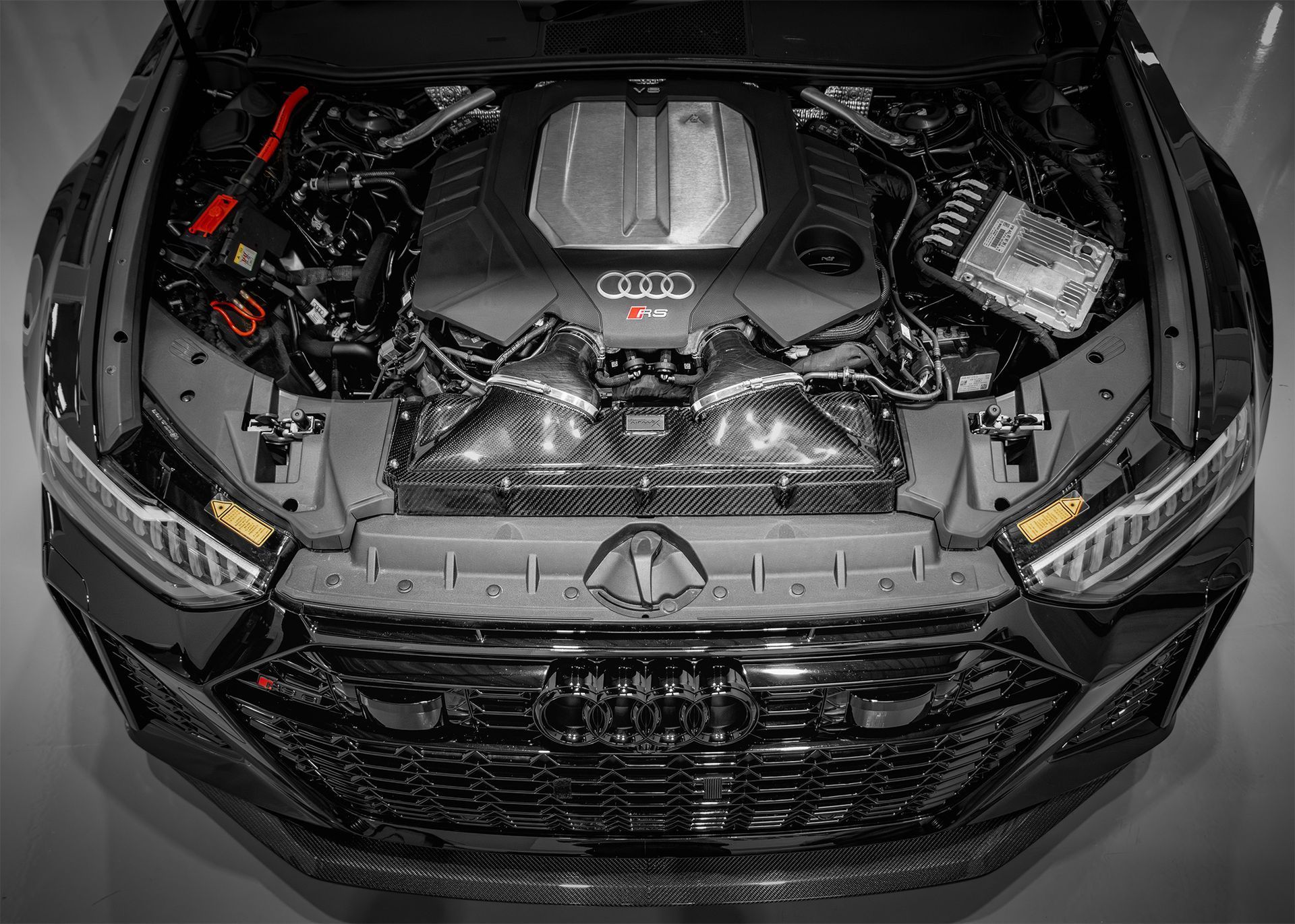 High-performance Audi RS engine with Pipercross AirMax carbon fibre details and advanced components.