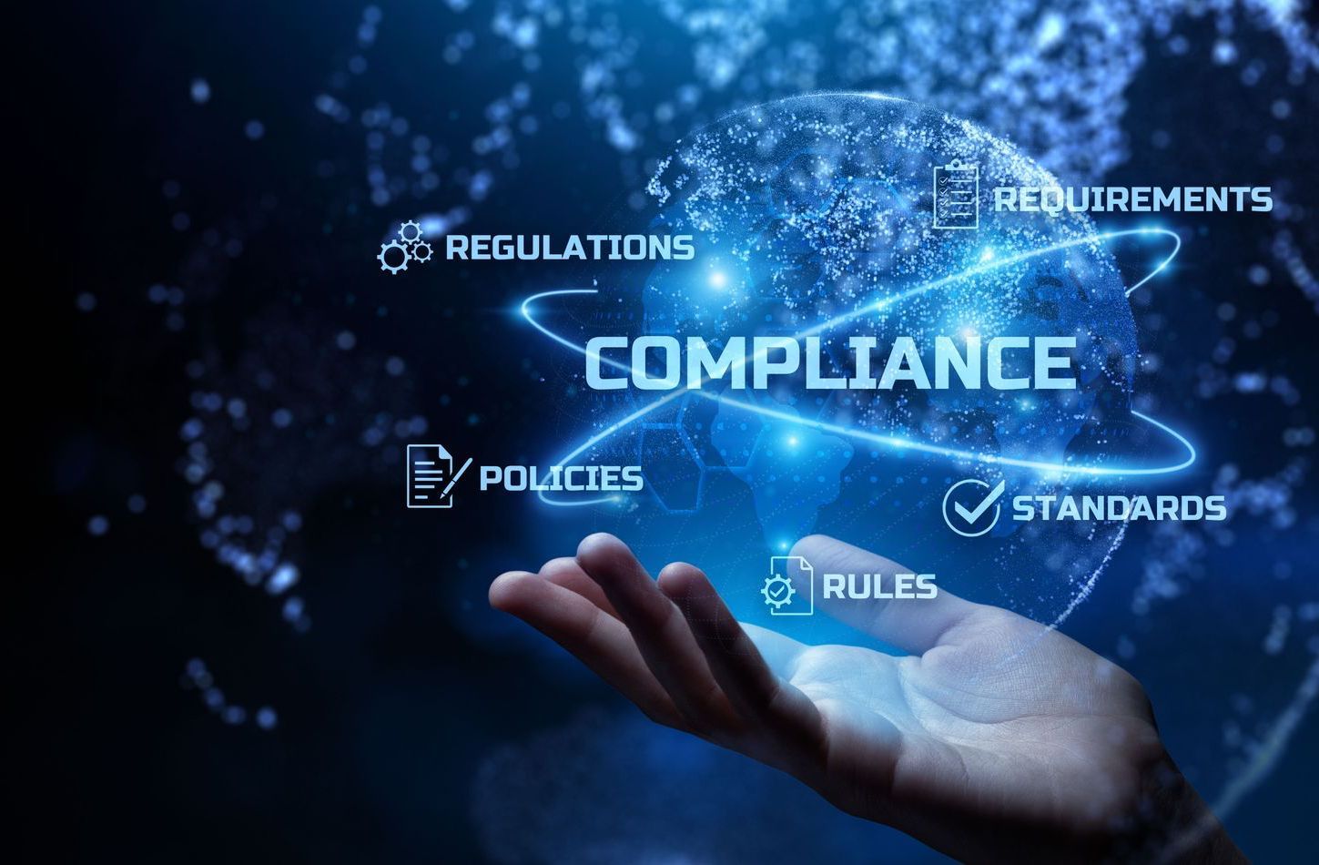 Hand holding a glowing globe representing compliance, standards, and regulations.