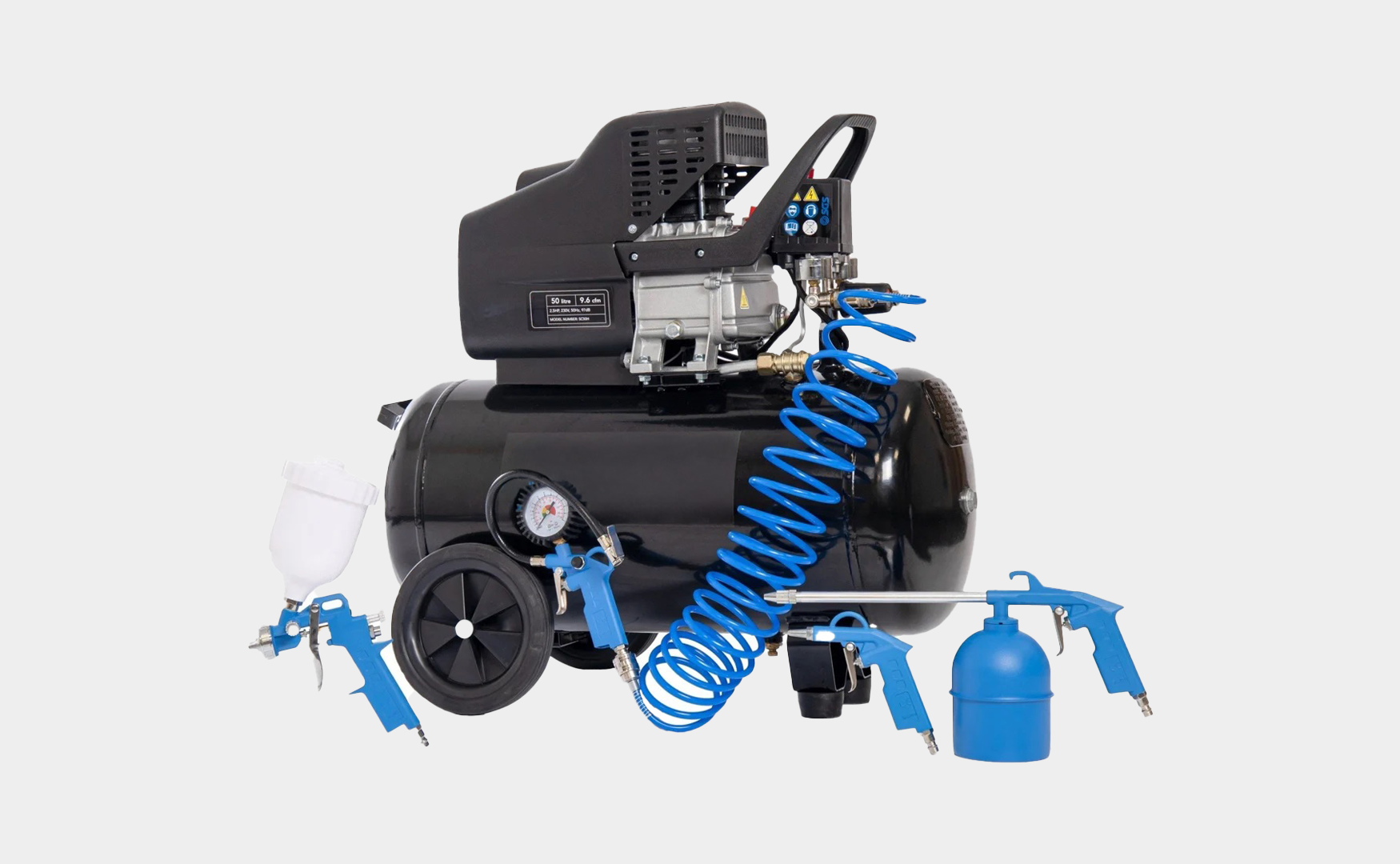 A collection of compressor spares, including a black air compressor, hoses and spray guns.