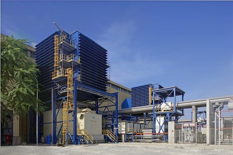 Energy & Power Systems - Industrial energy and power systems facility with blue structures and equipment.