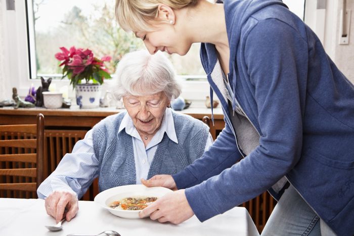 Senior Woman Getting Soup Served – La Quinta, CA – C'e Bella Home Care