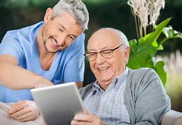 Caregiver and Senior Man Using Digital Tablet – La Quinta, CA – C'e Bella Home Care