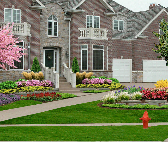 a large brick house with a fire hydrant in front of it