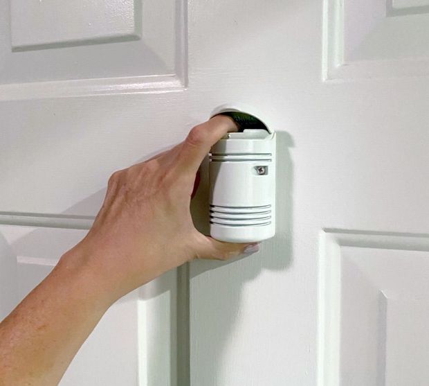 Discharge pepper spray from your door at the push of a button.