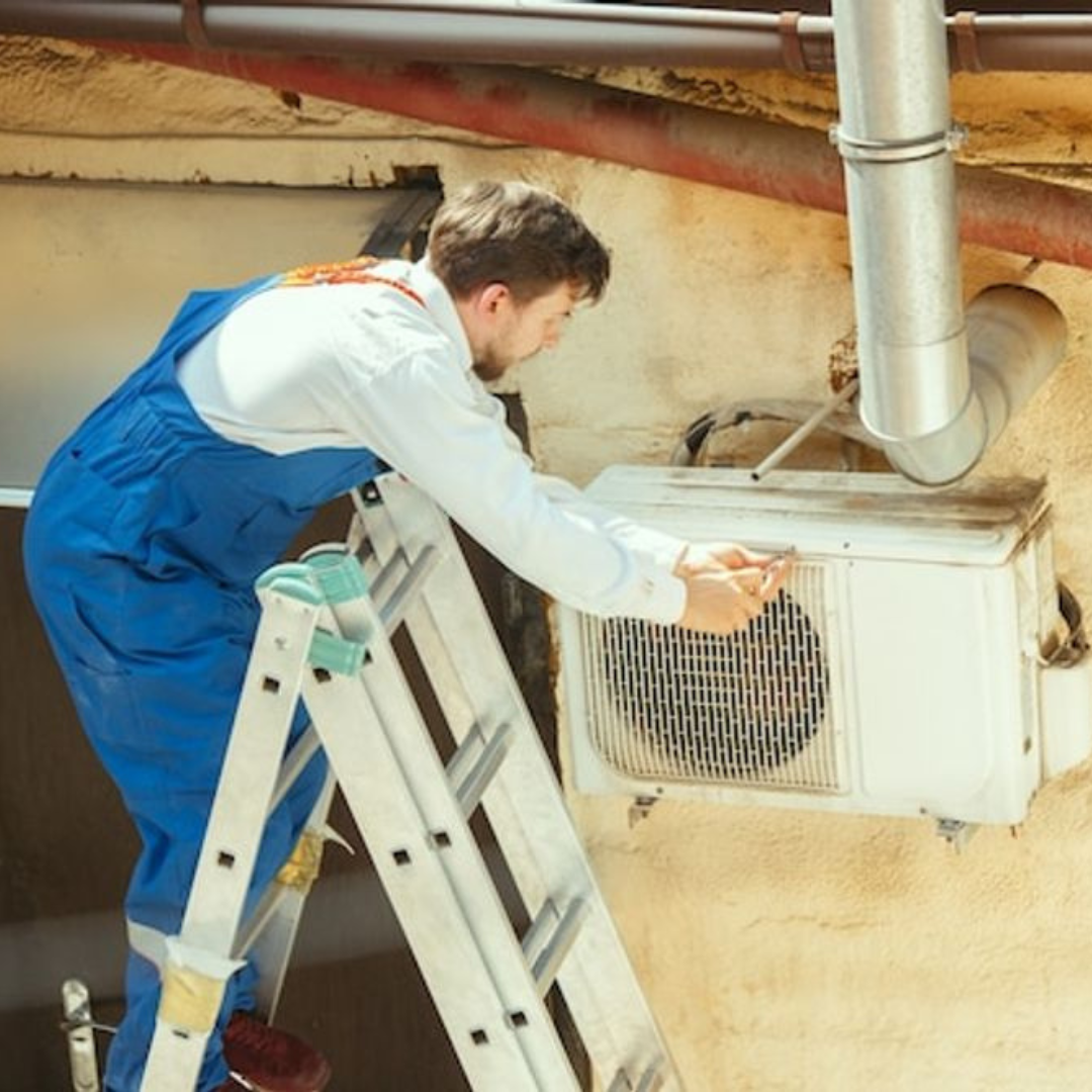 Michigan Air Care - working on an air conditioner