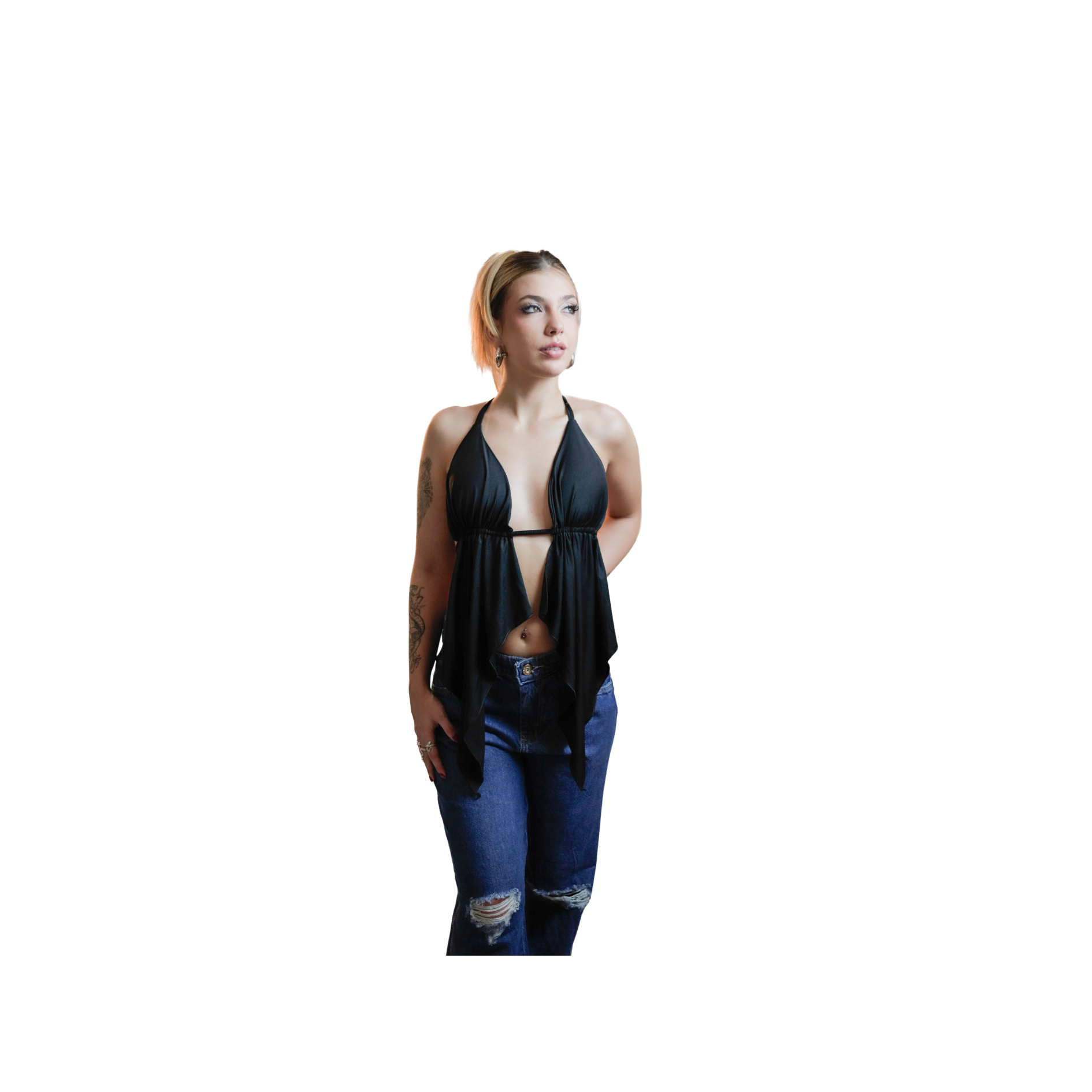 Woman wearing a black halter top and ripped blue jeans, looking to the side.