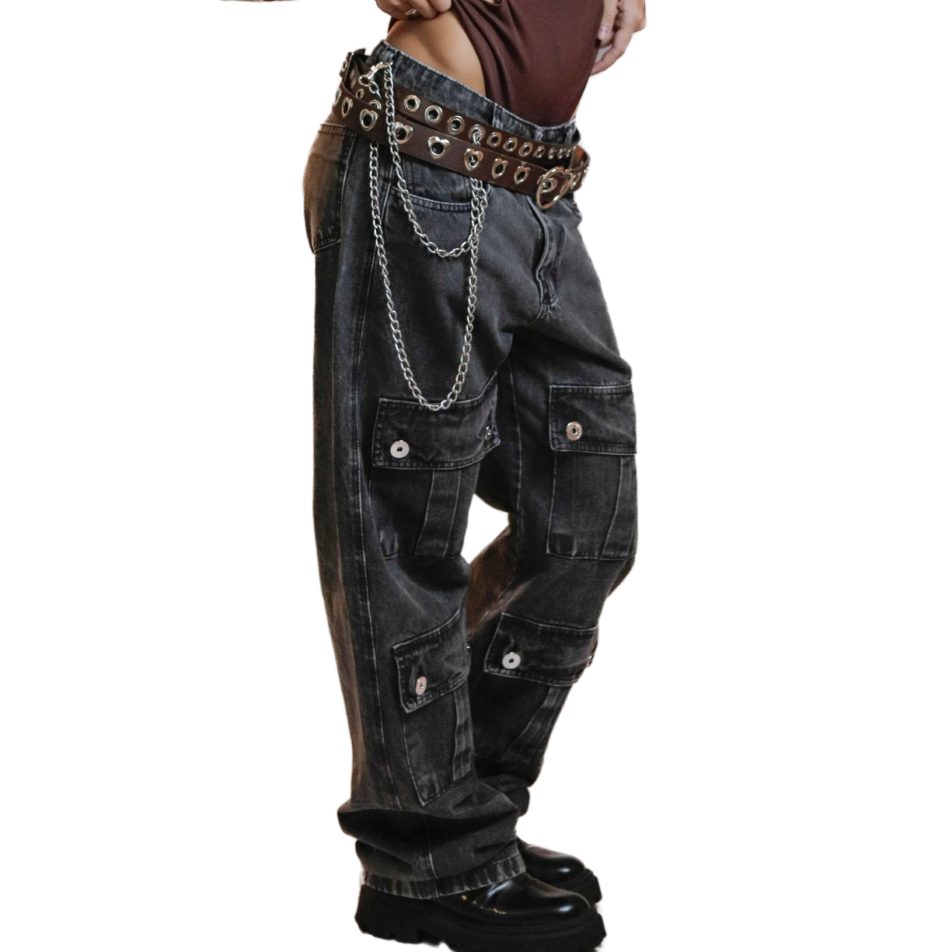 Person wearing dark, baggy cargo jeans with a studded belt and chain.